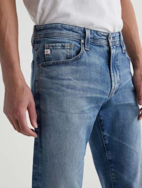 AG Tellis Aged Modern Slim Denim light blue men's jeans with 19-year fade and relaxed slim fit