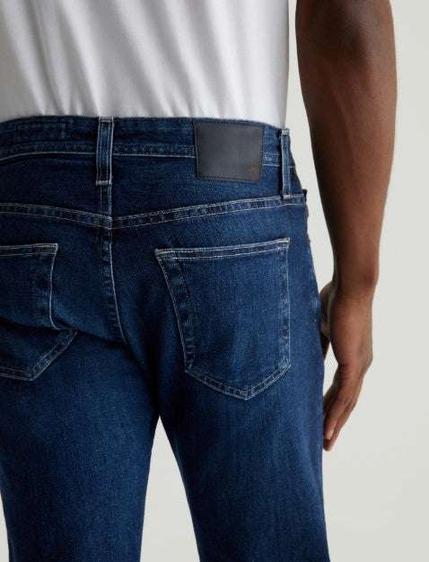 AG Tellis Modern Slim 360° Stretch Denim jeans in medium wash with tapered leg and modern slim fit