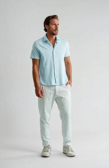 Stone Rose S/S men's light blue short sleeve shirt with white pants and sneakers