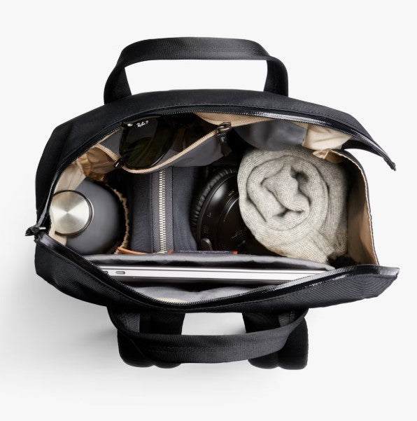 Bellroy Via Workpack black backpack with laptop, water bottle, and accessories inside showing organized compartments