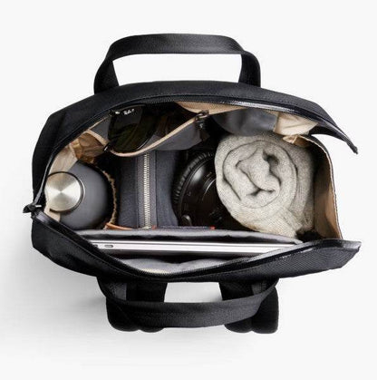 Bellroy Via Workpack black backpack with laptop, water bottle, and accessories inside showing organized compartments