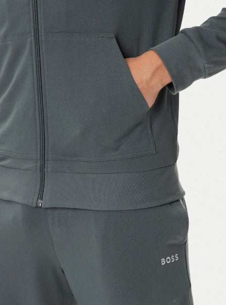 Hugo Boss Mix & Match Jacket in green with embroidered branding, sporty piping, zip neck, and kangaroo pocket
